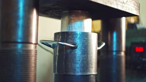 industrial press machinery. powerful press creates the shape of the detail. close-up shot.