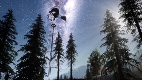 retro windmill in mountain forest