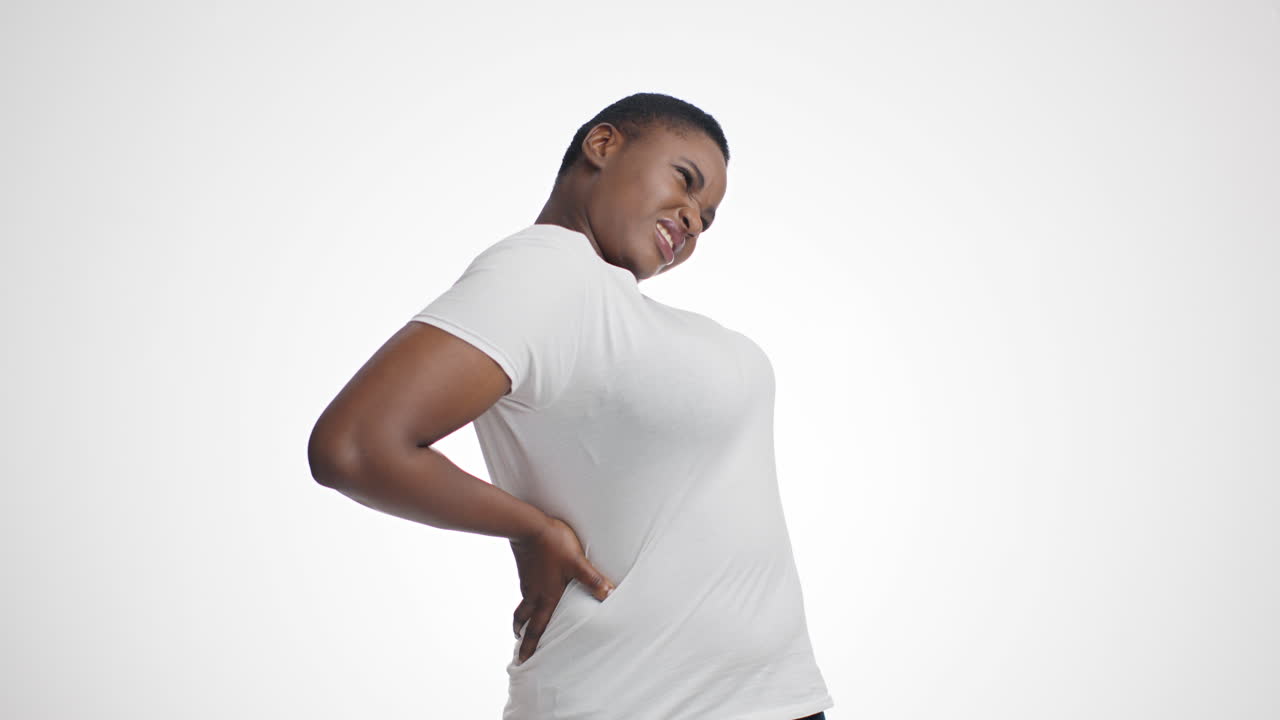 mujer con dolor de espalda