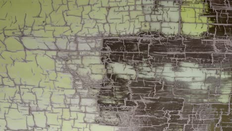 cracked pale yellow paint surface