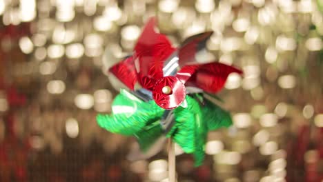 pinwheel spinning with golden shimmer wall backdrop