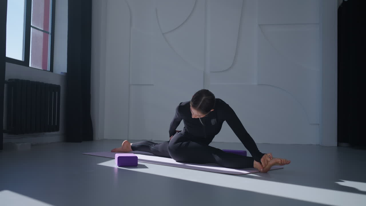 Woman Doing Yoga Stretches
