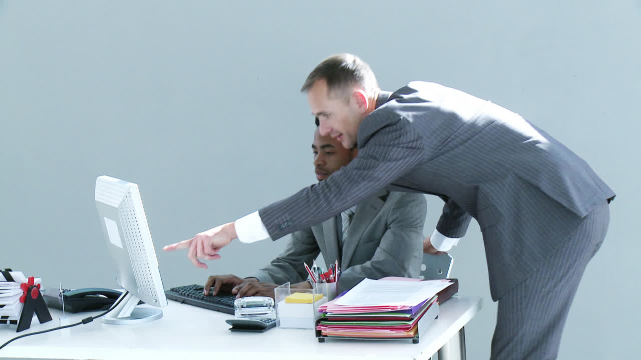 Businessmen working together in office