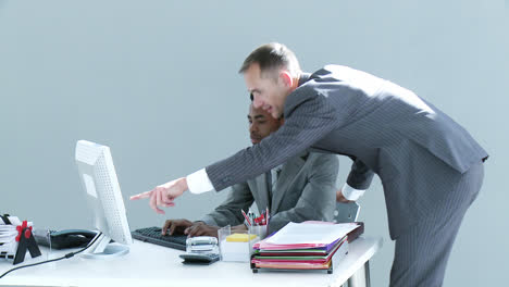 Businessmen-working-together-in-office