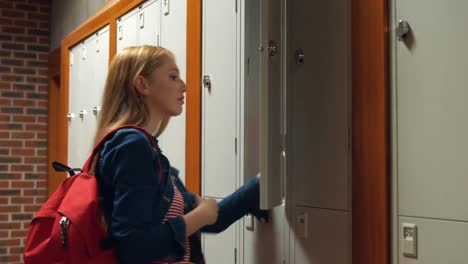 Student-gathering-her-school-books-from-a-locker