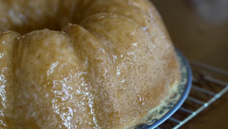 brushing glaze on a kentucky butter cake - zoom out - pound cake series