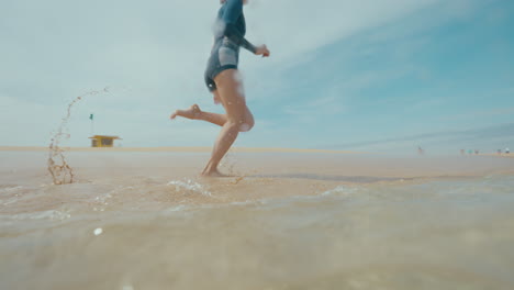 woman running on the beach