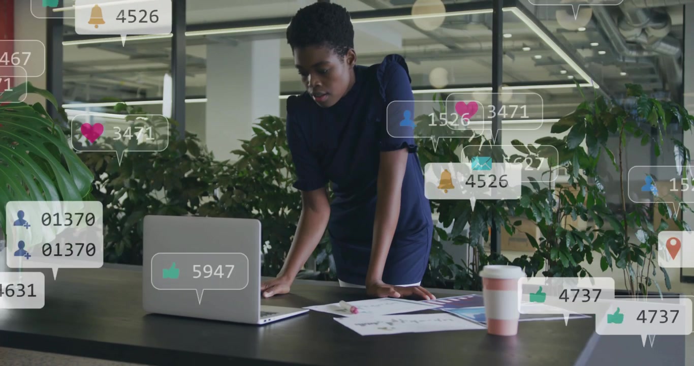 Vertical video: Woman touching laptop and sorting papers, generating social badges for marketing