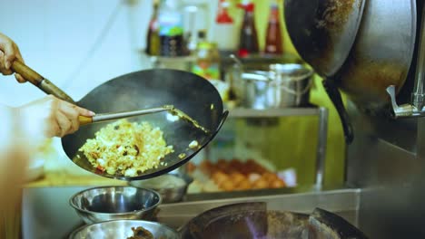 chef skillfully prepares dish in a wok