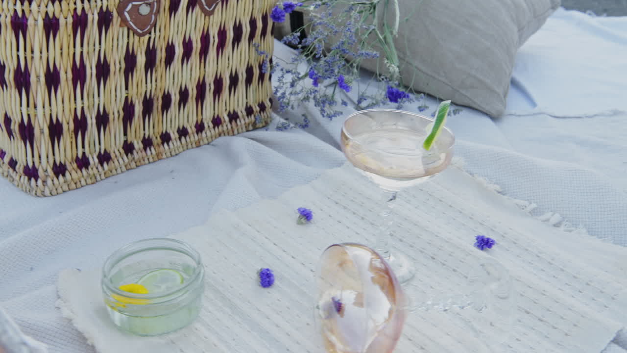 Champagne And Tiny Purple Lavender Flowers On The Flat Lay Luxury Summer Picnic Set Up - close up