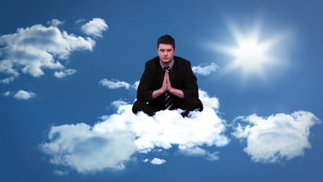 Calm-meditating-businessman-sitting-on-cloud