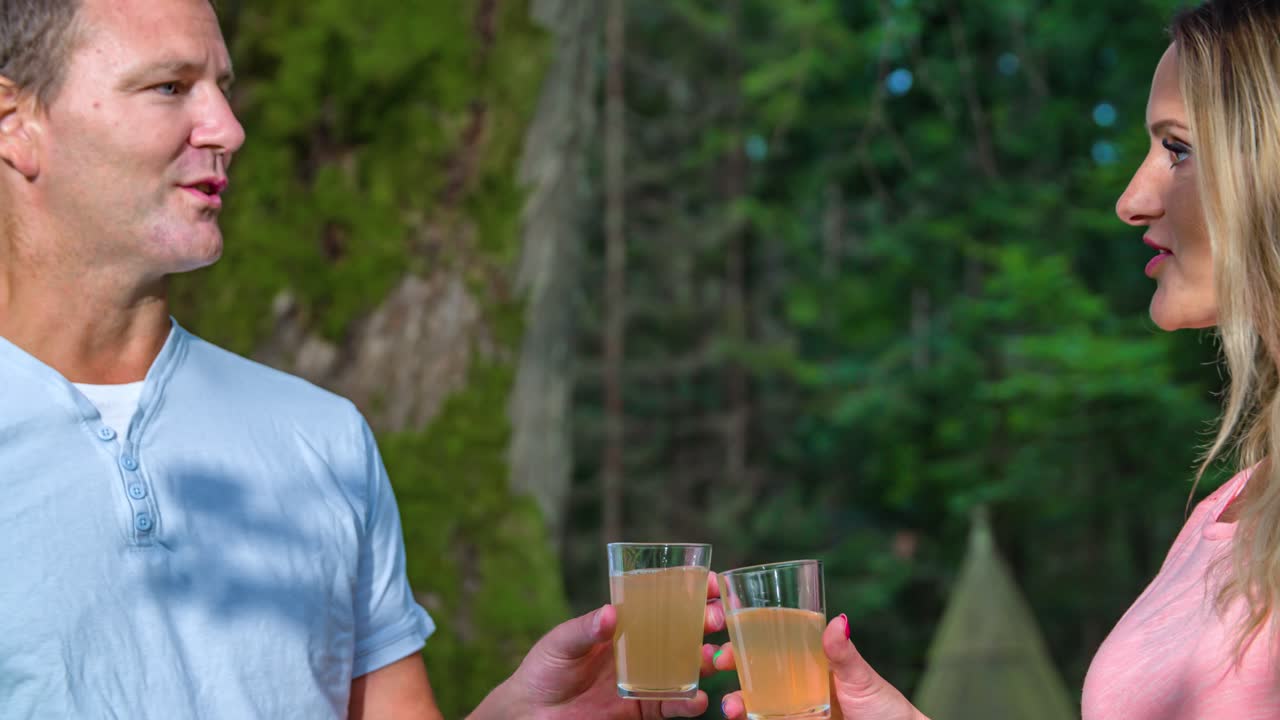 Happy Caucasian woman and man toast before drinking. Cheers, slow motion