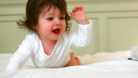 cute baby crawling on the bed