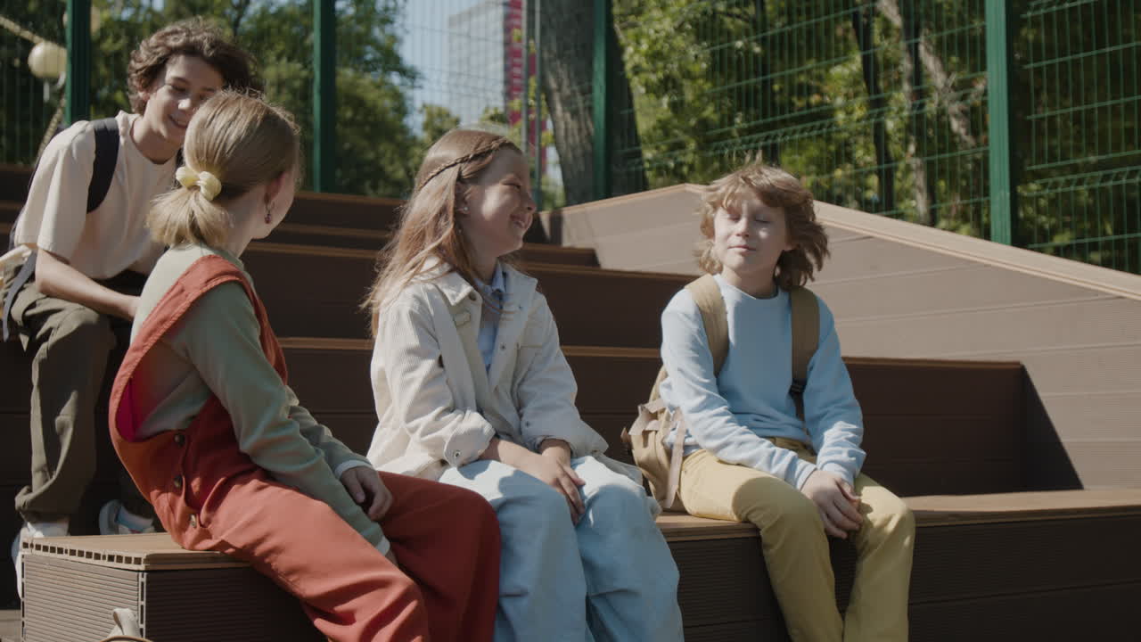 Group of children socializing outdoors on a sunny day