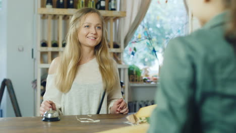 the seller at a small grocery store is talking to the buyer