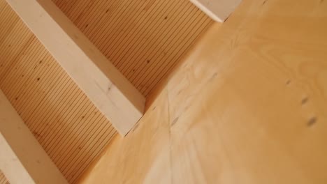 detail of a wooden wall with a wooden roof in a new residential building construction