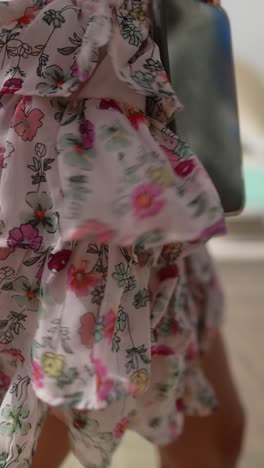 woman wearing a floral print ruffle skirt