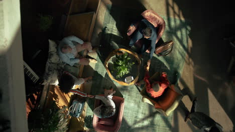 Overhead view of people meeting in a living room