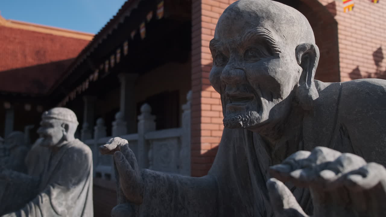 Stone Statues of Buddhist Monks in a Temple