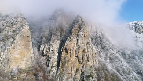 snowy mountain peaks in a misty landscape