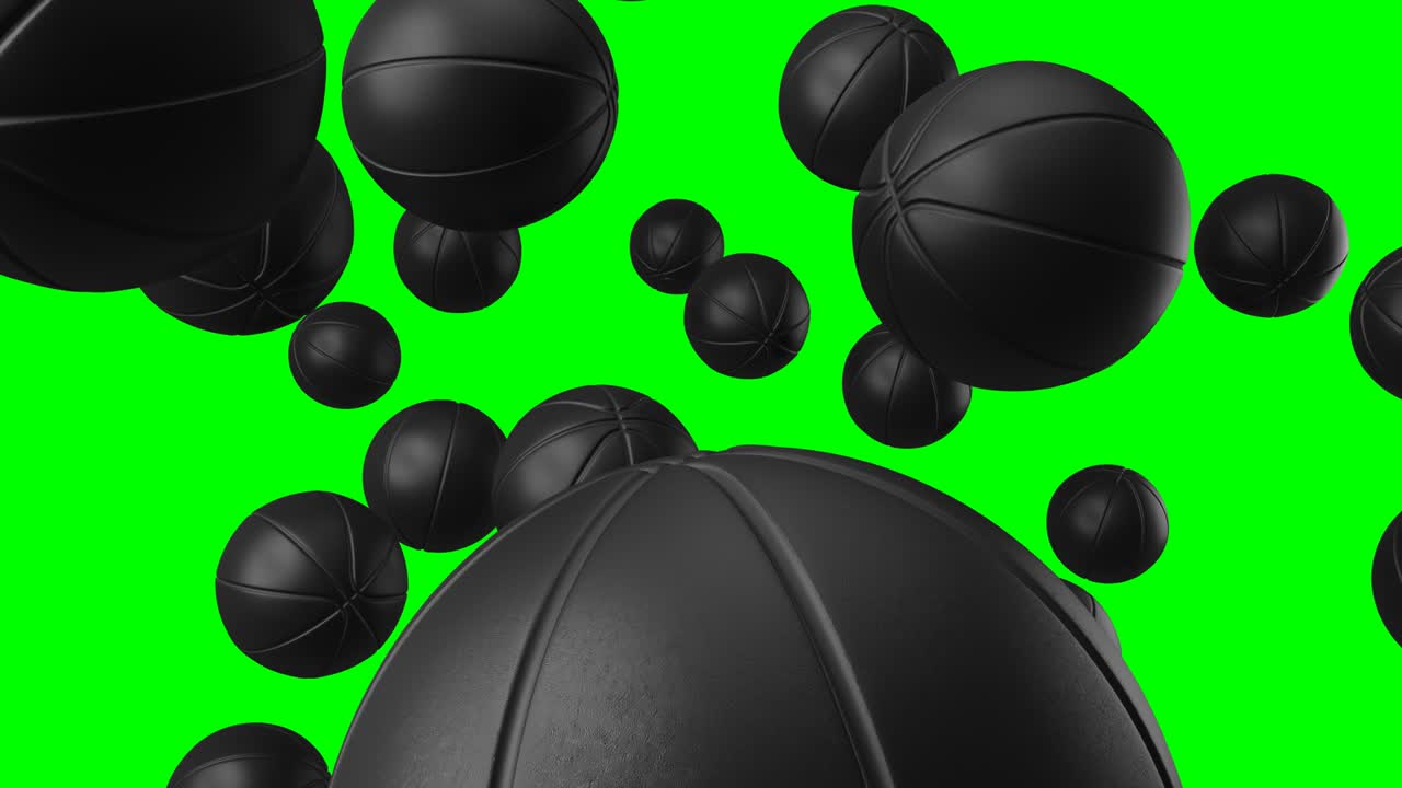 Many black basketball balls on green chroma key.