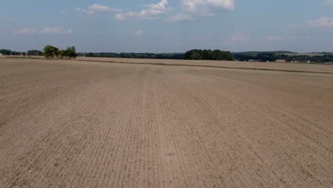 Low-Aerial-of-Plowed-Empty-Field-Nature-Fast-4K