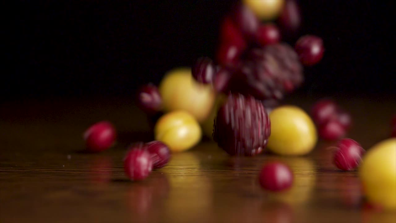 Mixed Berries Falling on a Wooden Surface
