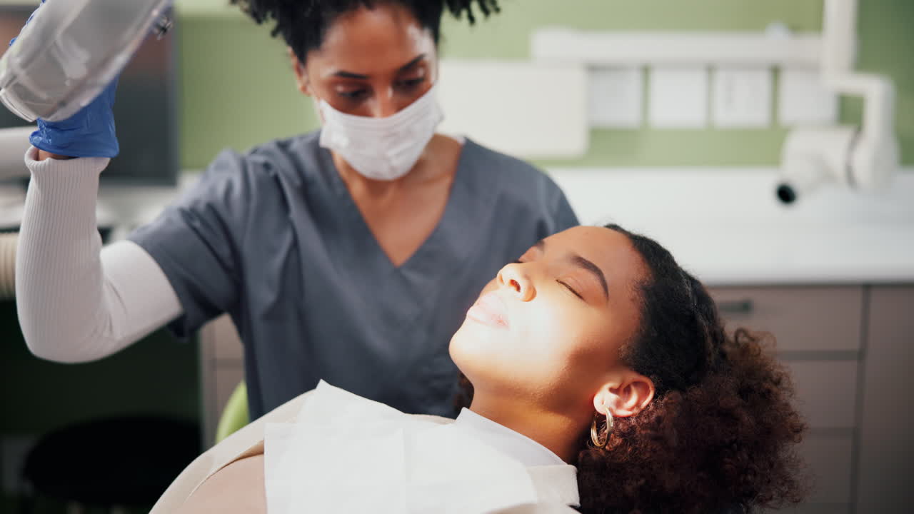 Dentist examining a patient's teeth