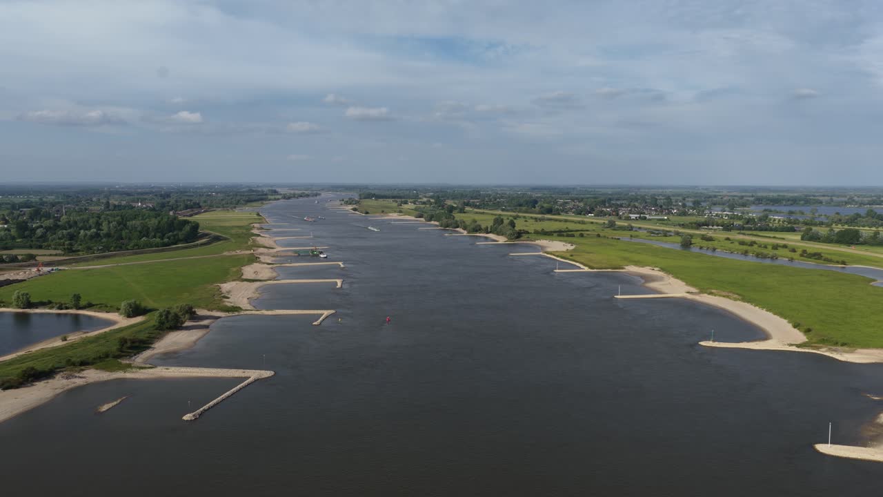 Waal river, Major river in The Netherlands, waterway, shipping and transport route. Aerial drone video.