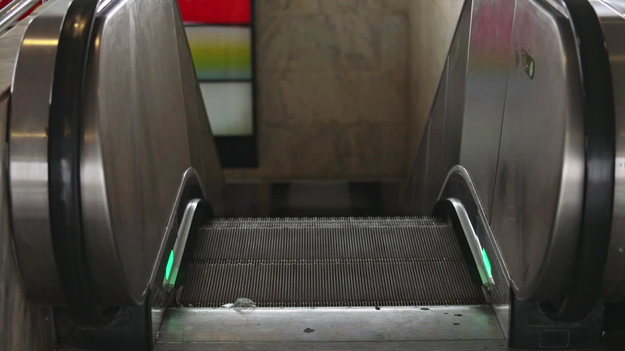 Empty Escalator Going Down in a Subway Station