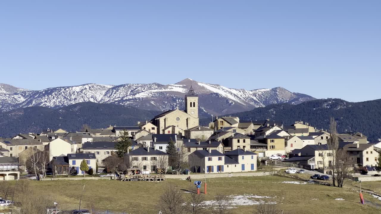 A frame featuring the old town center and the church in the Les Angles ski resort in France