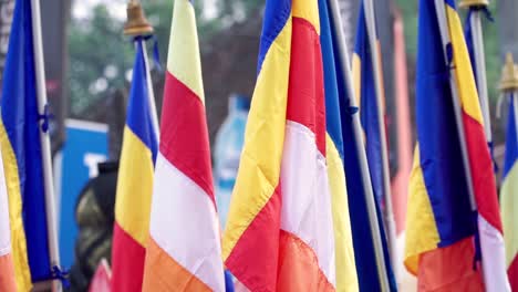 close up shot of colorful buddhist flag on vesak day parade celebration in indonesia