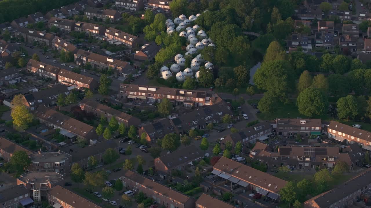 Reveal shot of Bolwoningen 's-Hertogenbosch in middle of city, aerial