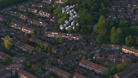 Reveal-shot-of-Bolwoningen-'s-Hertogenbosch-in-middle-of-city,-aerial