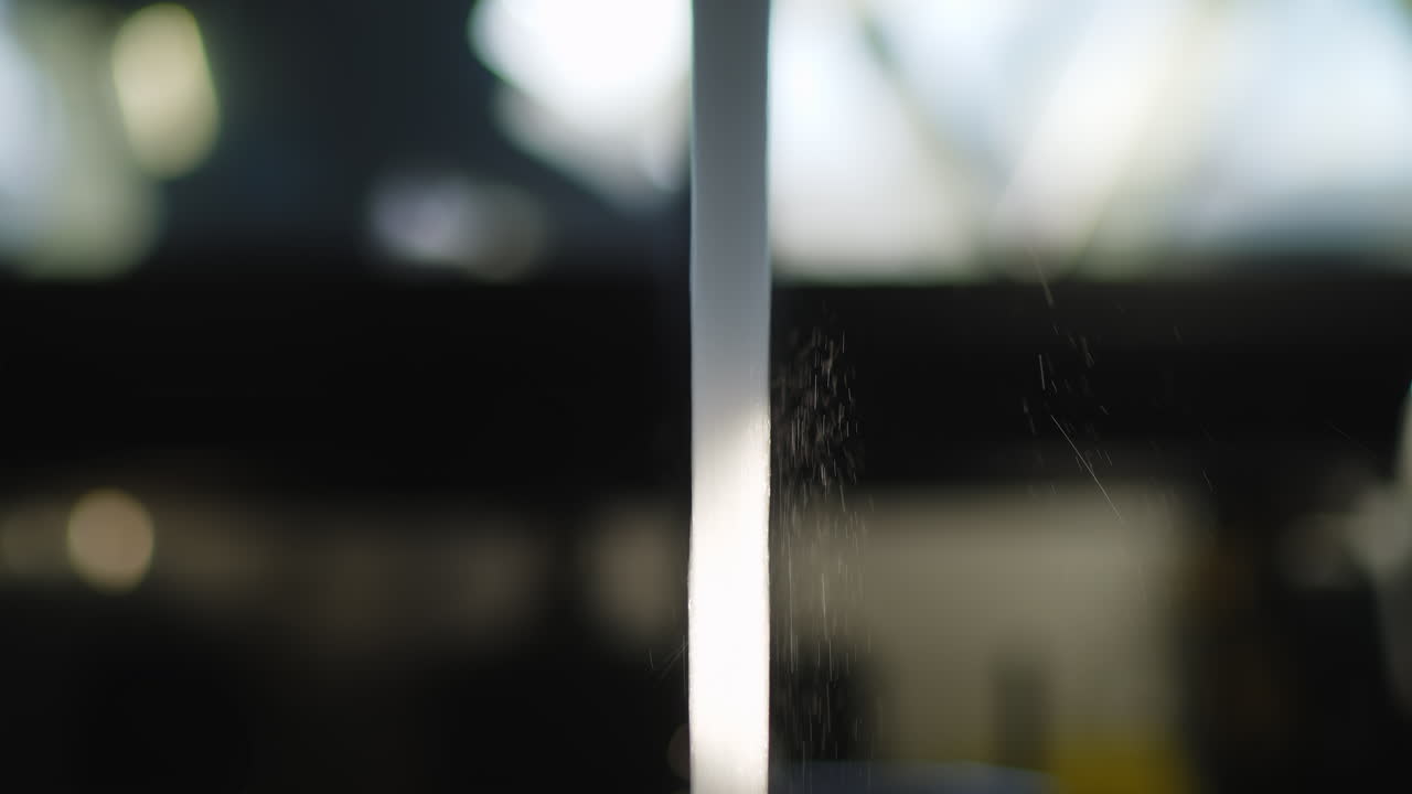 Close-Up of Water Stream Flowing from a Faucet