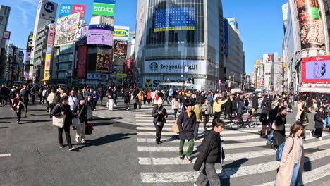 pedestrians crossing a busy urban intersection