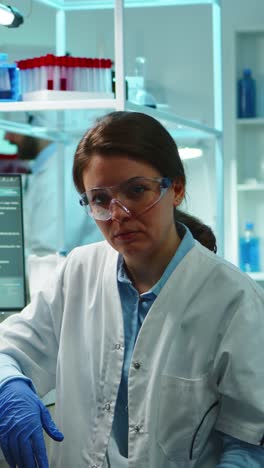 vertical video: portrait of scientist nurse looking exhausted at camera
