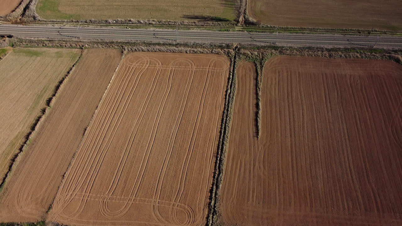 Aerial View of Farmland with Train Tracks