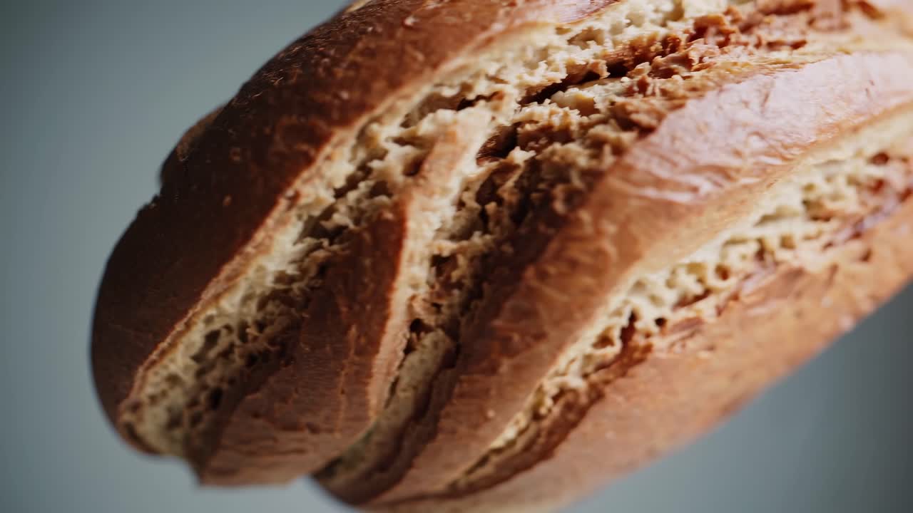 Video showcasing a close-up of freshly baked bread, highlighting texture and crust details, shot