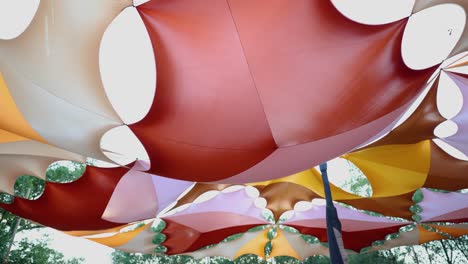 colorful canopy made of fabric, creating a vibrant overhead decoration