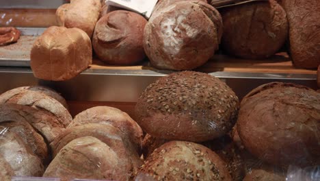 assortment of freshly baked breads in a bakery