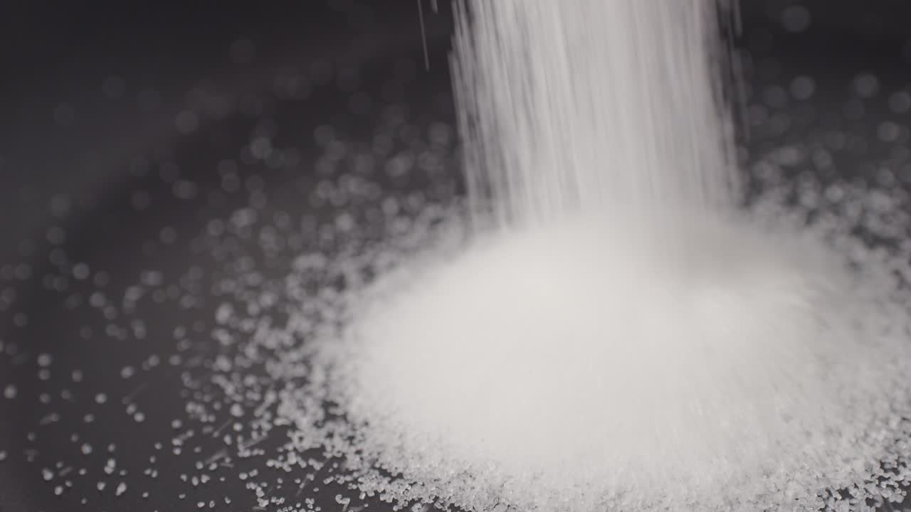 Close up of boiling sugar with bubbles turns into caramel, caramelization, chef cooking dessert in cafe, restaurant pastry food.