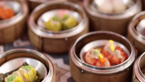 a vibrant array of dim sum dishes presented in bamboo steamers, showcasing a variety of colors and textures.