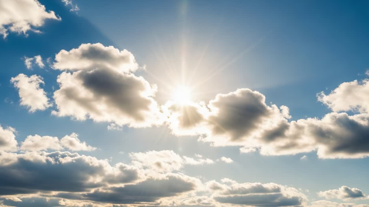 Sunlight Breaking Through Clouds in a Blue Sky