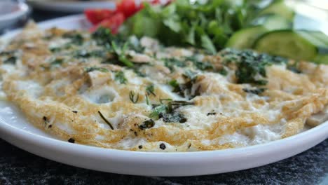 a delicious omelette with herbs and vegetables