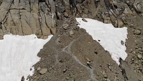 drones fly over a glacial lake and over rocks and ice - ordesa tucarroya