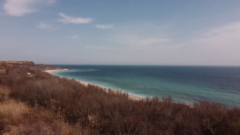 aerial view of empty beach with turquoise water