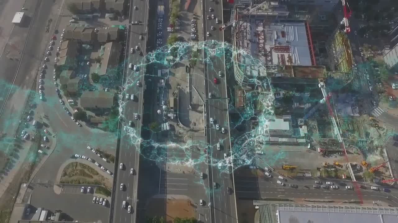 Animation of digital brain rotating over aerial city view
