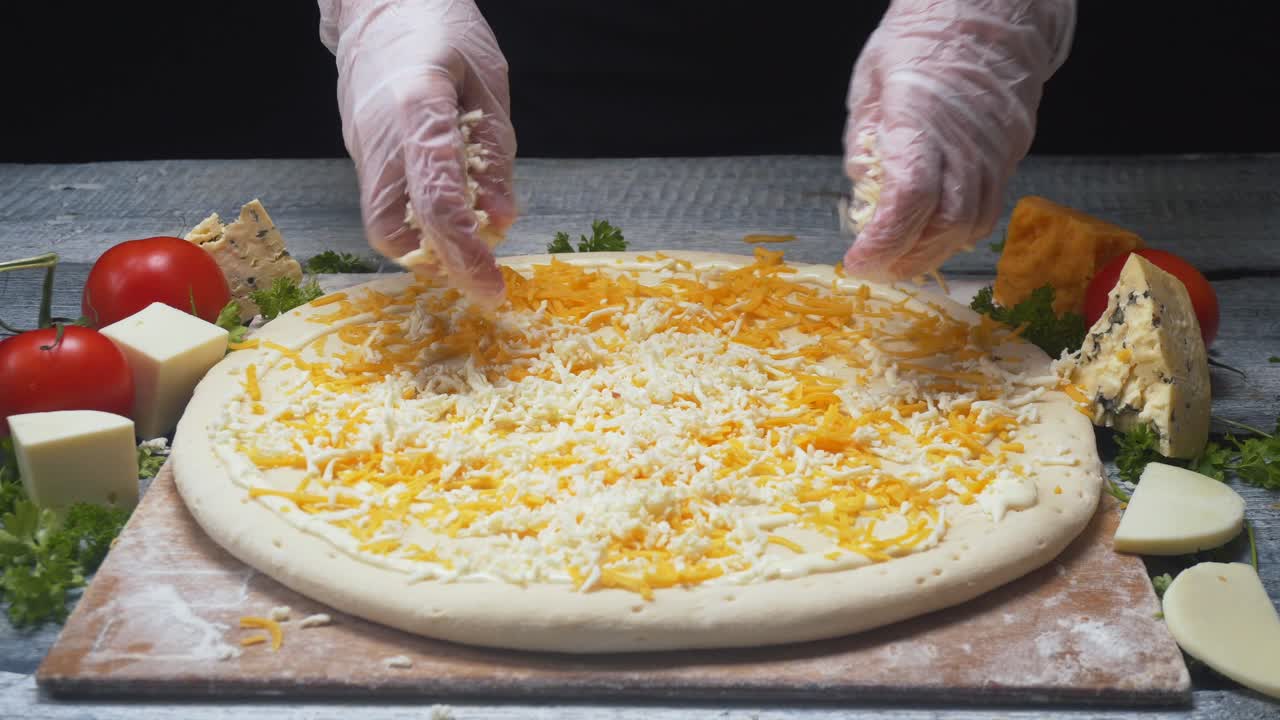 Chef making a pizza with cheese