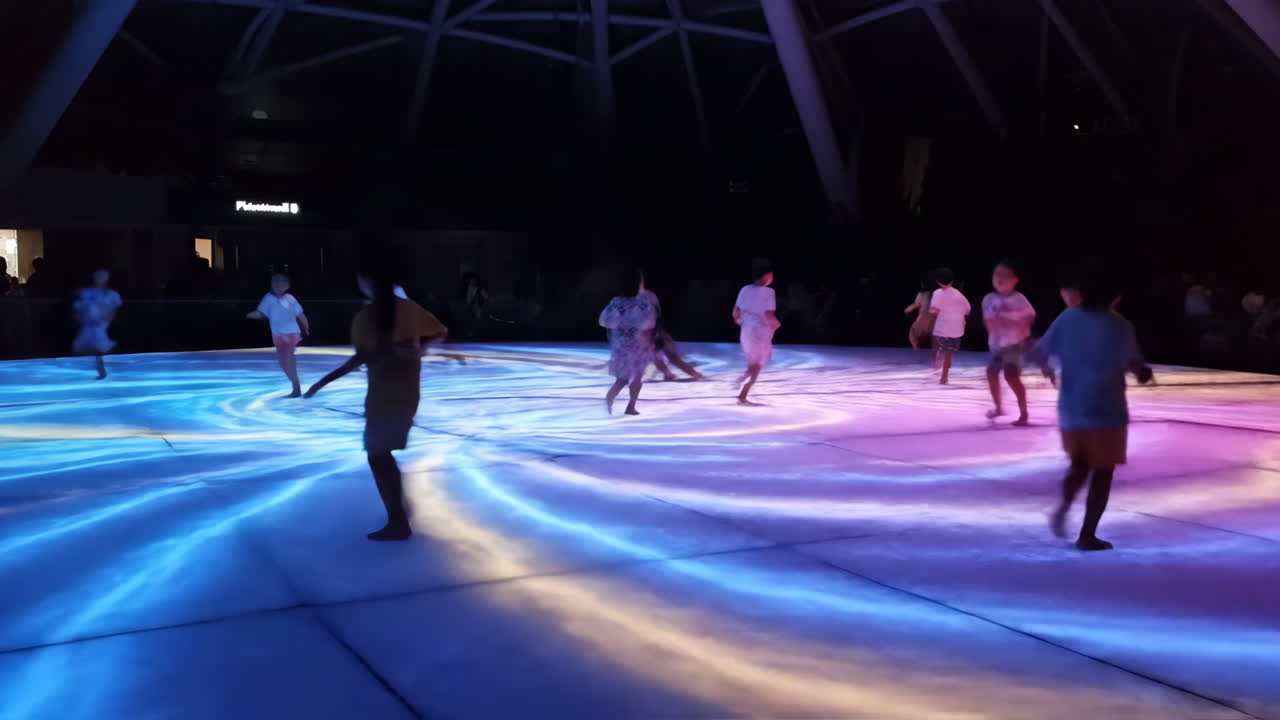 Children playing on an interactive digital floor projection